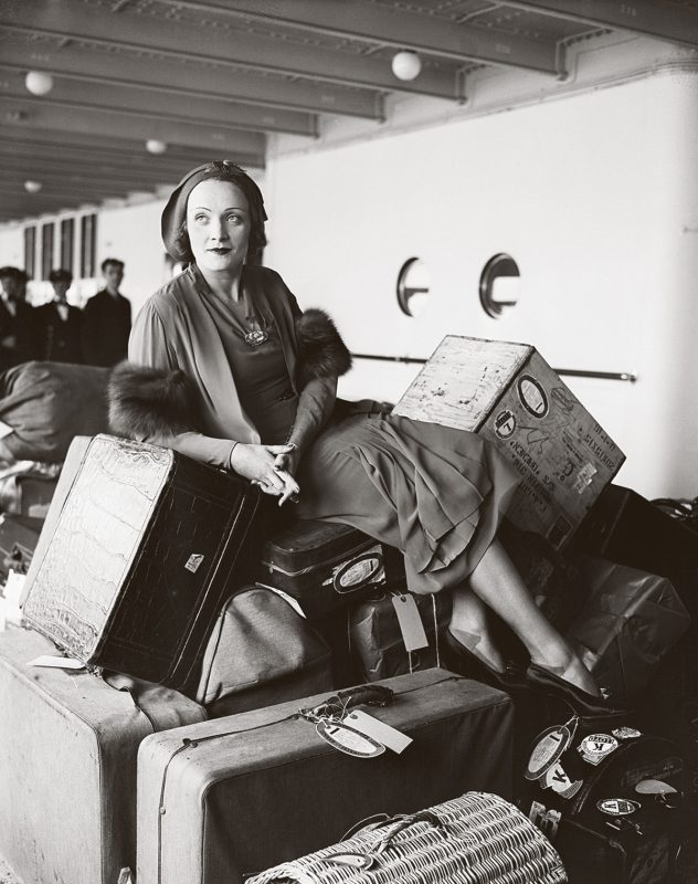 German-movie-star-Marlene-Dietrich-with-a-pile-of-luggage-en-route-to-the-USA-on-the-ocean-liner-Bremen-1931-Bettmann-Archive-Getty-Images
